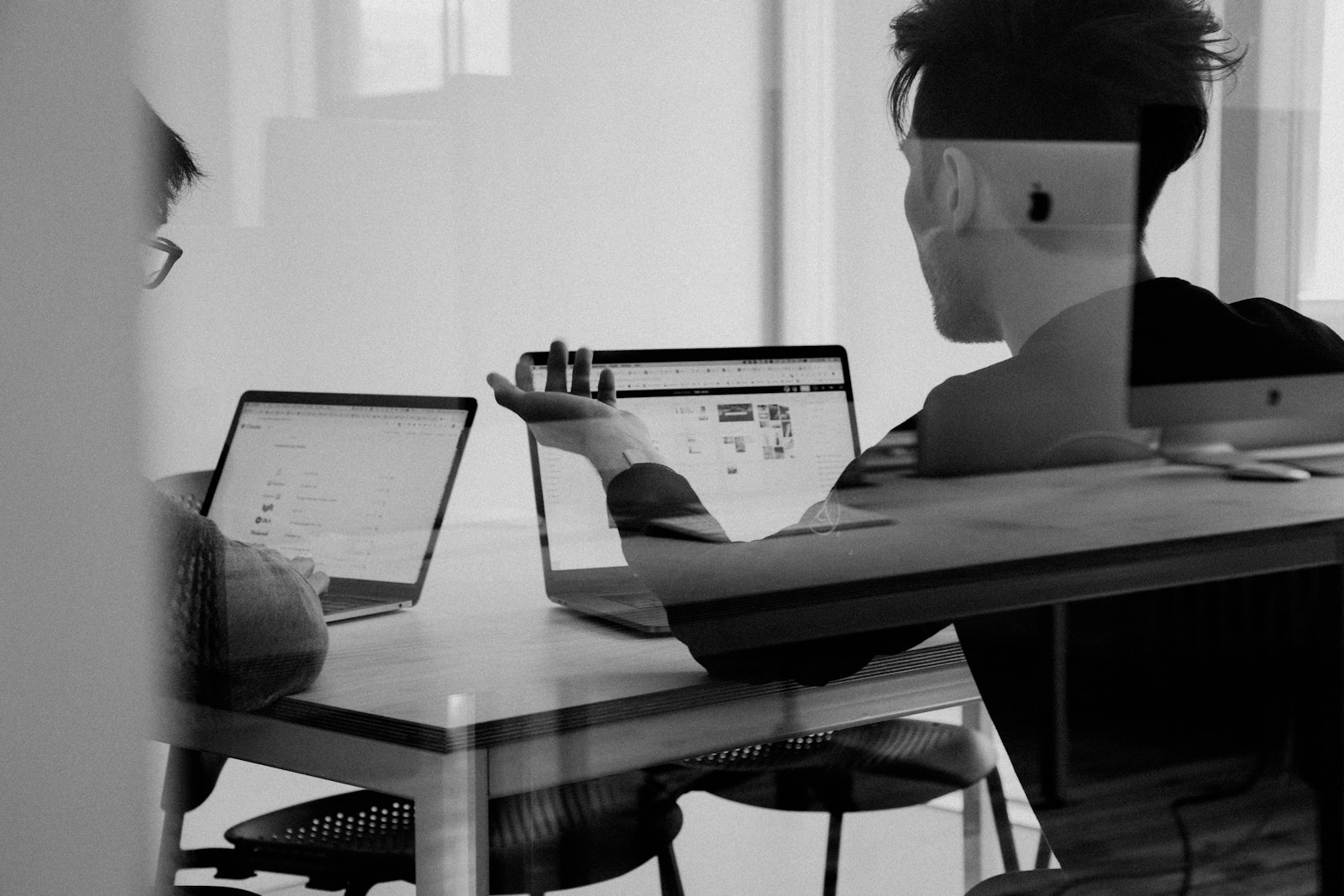 Consultants reviewing a client's systems together